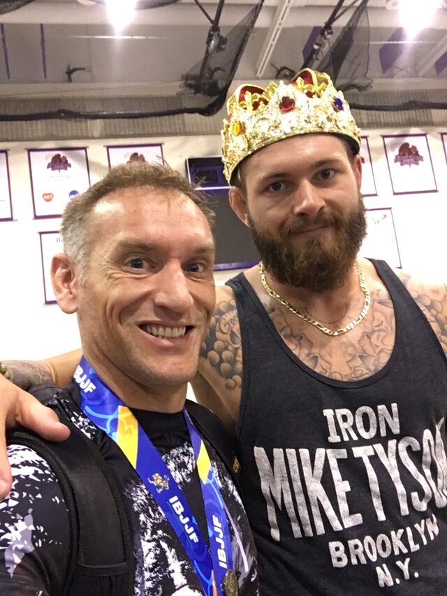 Our head instructor, wearing his IBJJF medal, with grappling champion Gordon Ryan at an IBJJF event.