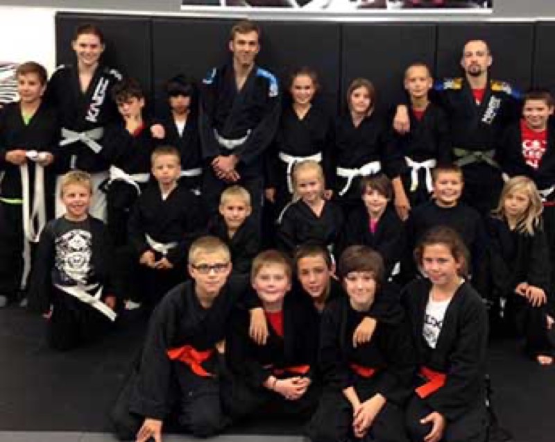 A real kids karate class group photo at Rumble Martial Arts.
